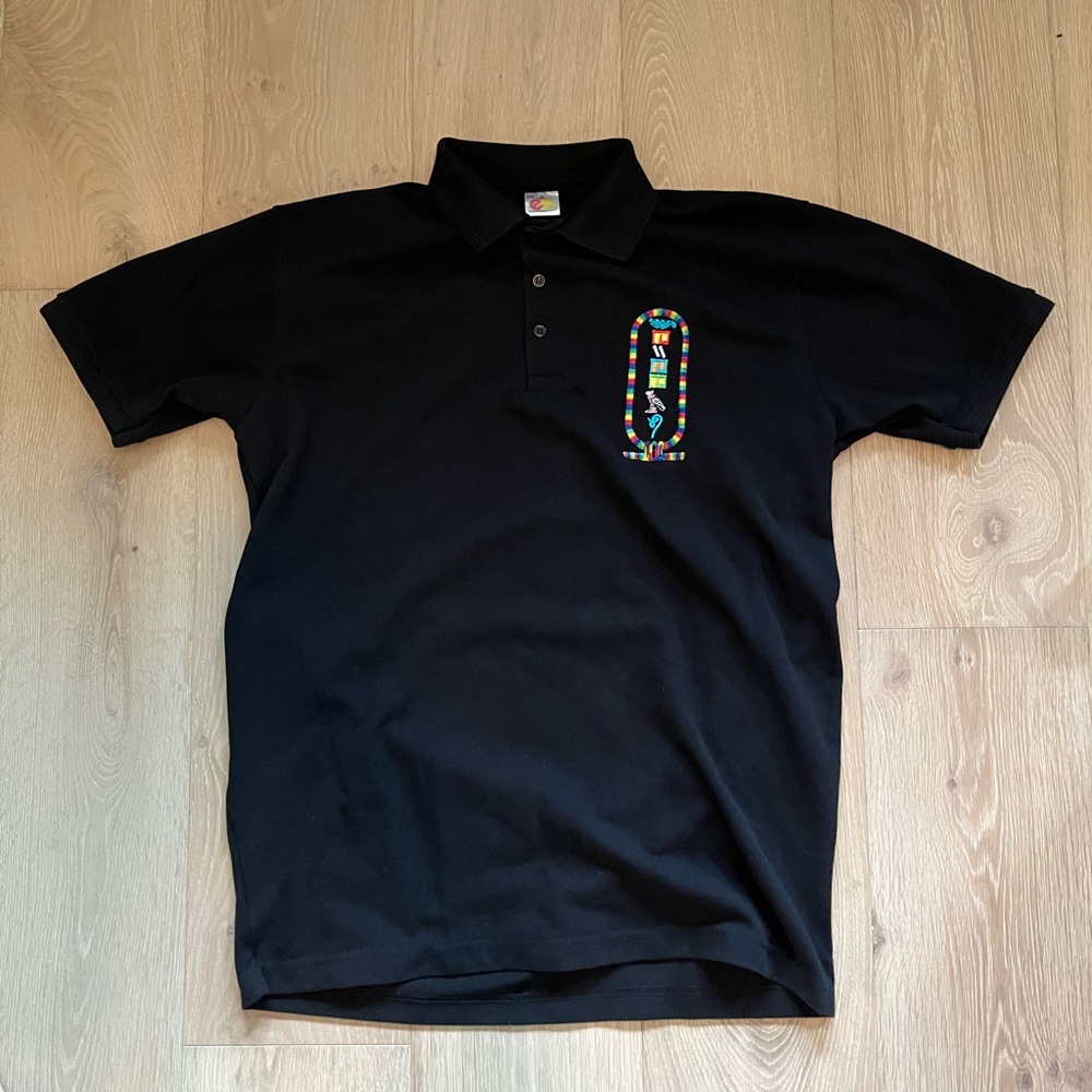 Black Embroidered Egypt polo with Egyptian symbols on the front
